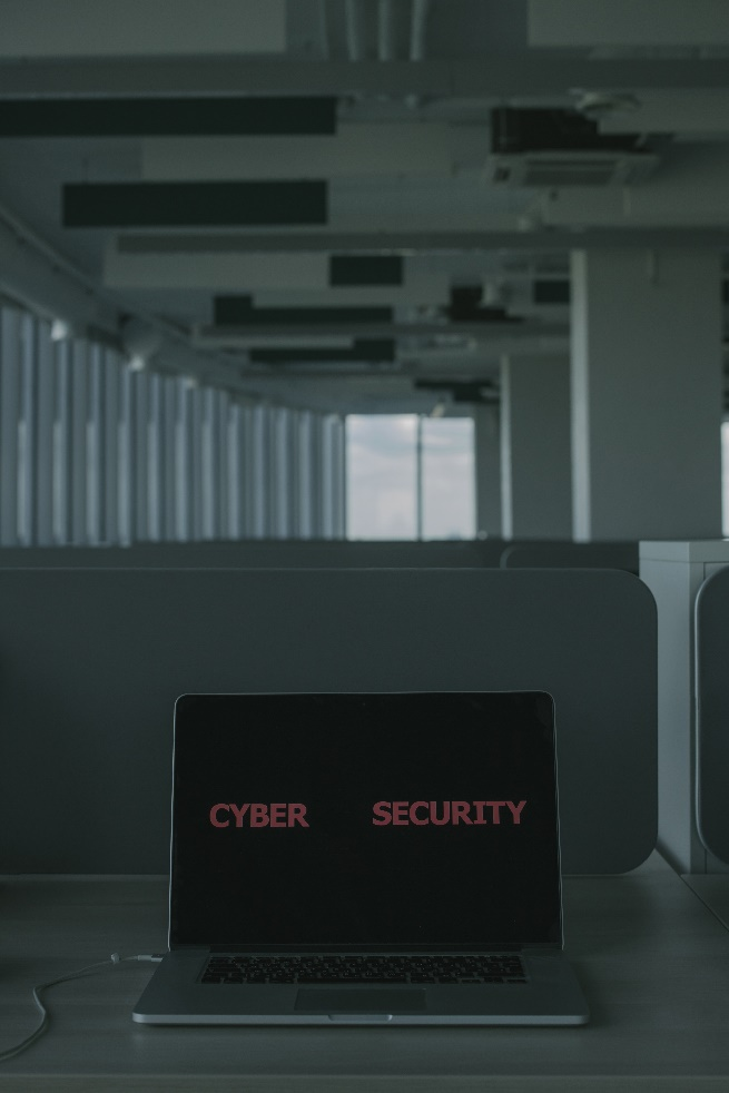 a laptop with cybersecurity text on the screen