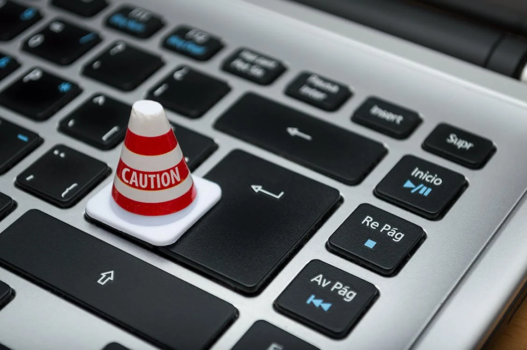 A caution mini-cone on a keyboard