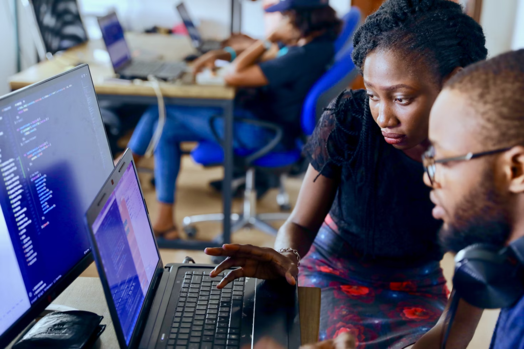 Two people working on a custom technology solution