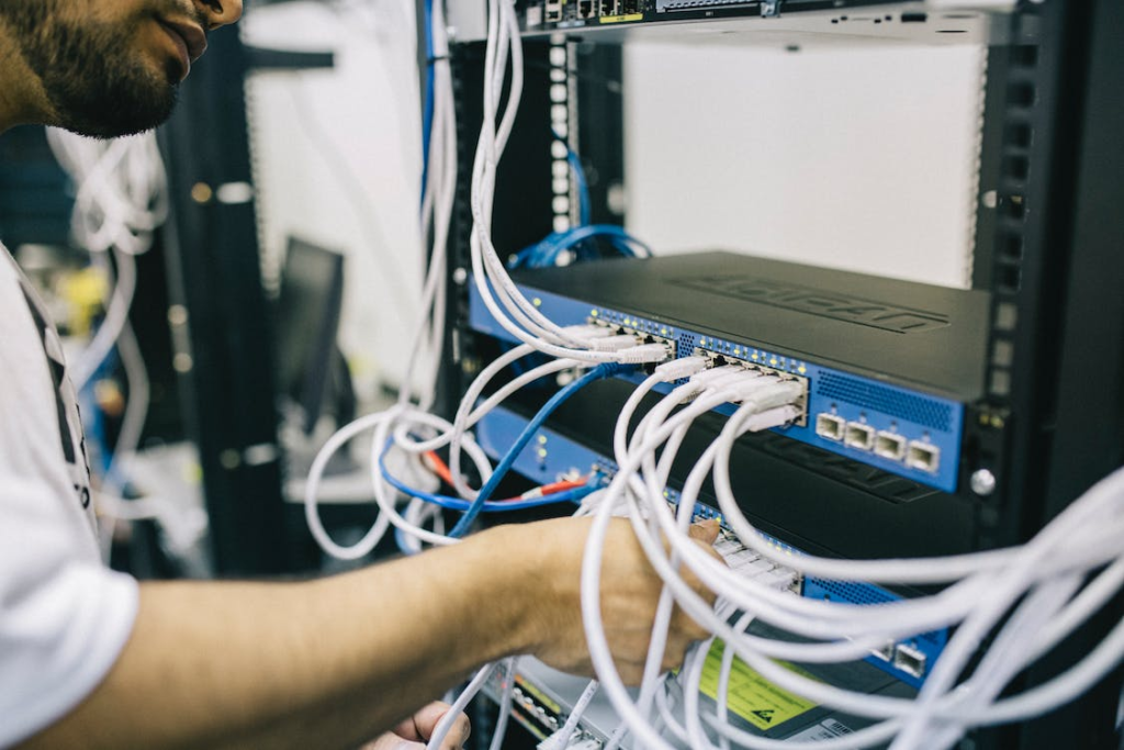 a person is fixing server cables. 