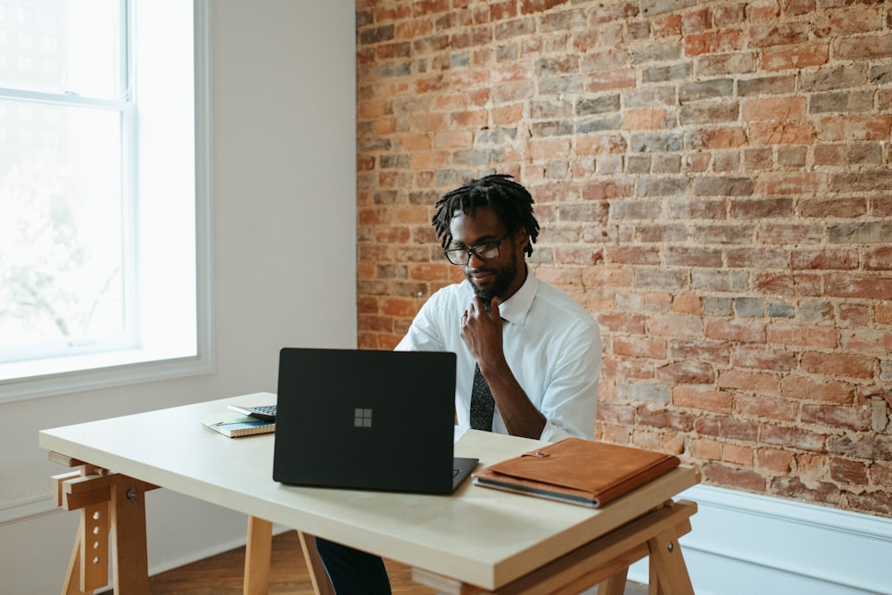 a man taking an online meeting.